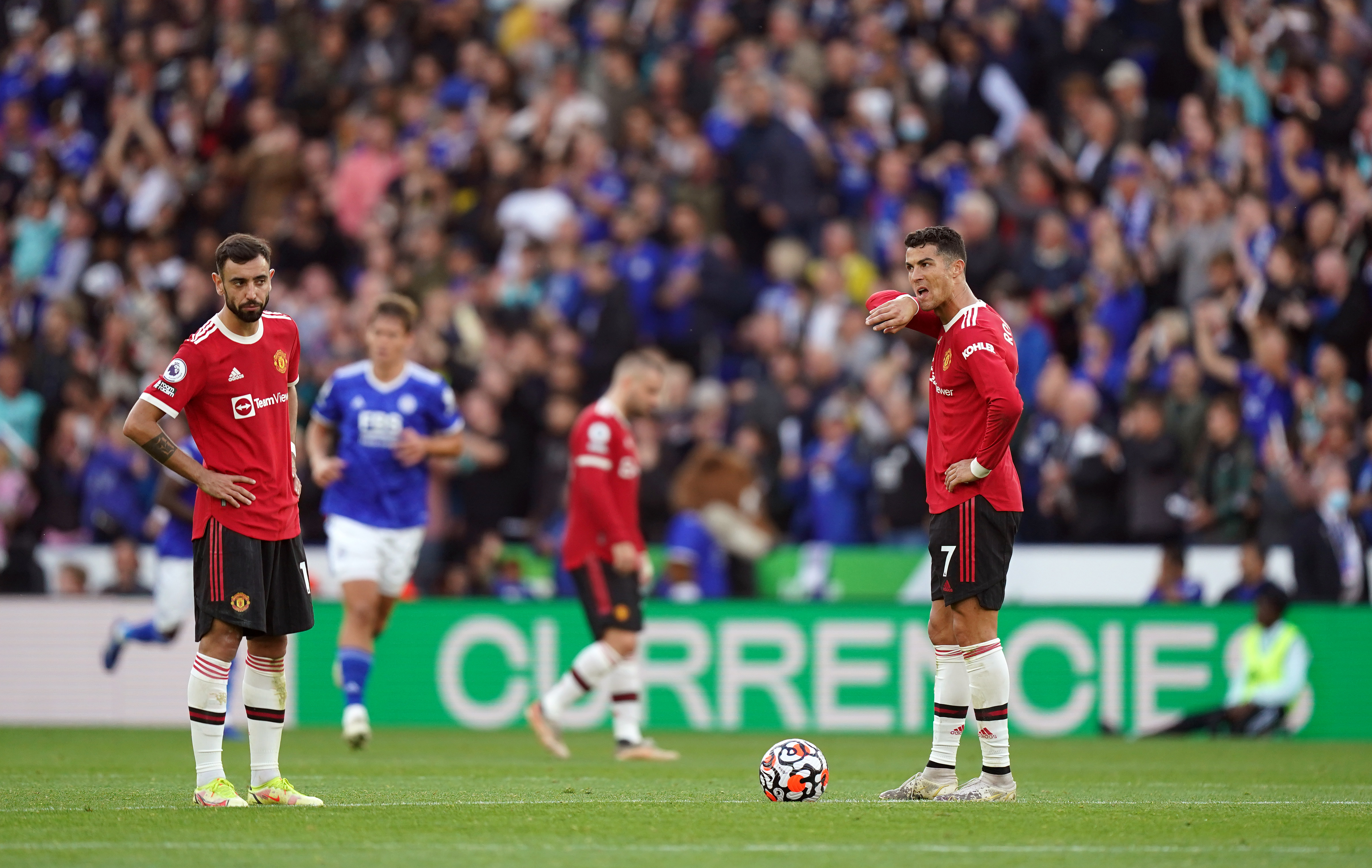 Cristiano Ronaldo stands dejected with Bruno Fernandes