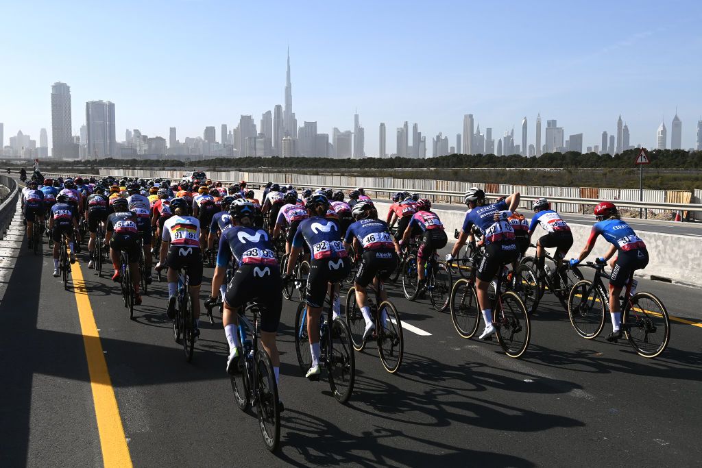 DUBAI UNITED ARAB EMIRATES FEBRUARY 09 A general view of the peloton passing through a Dubai city landscape with the Burj Khalifa in the background during the 1st UAE Tour Women 2023 Stage 1 a 109km stage from Port Rashid to Dubai Harbour UAETourWomen on February 09 2023 in Dubai United Arab Emirates Photo by Tim de WaeleGetty Images