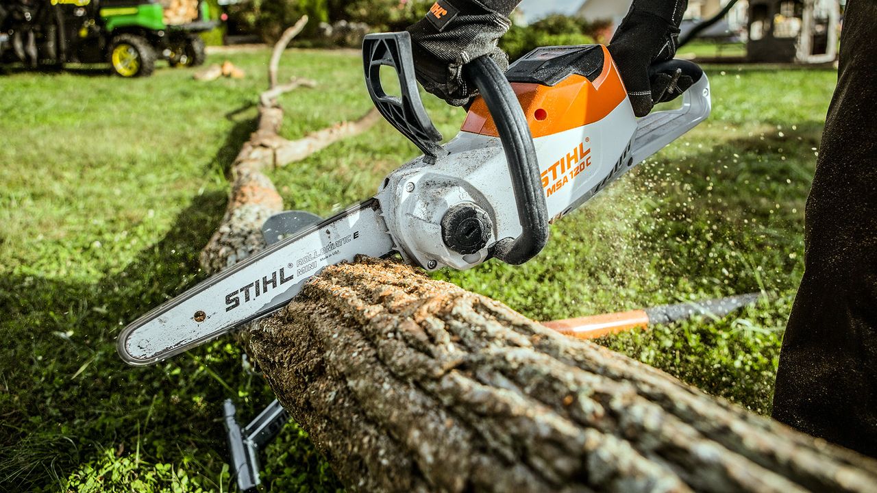 Stihl petrol chainsaw cutting log