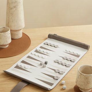 A brown and white backgammon set from Net-A-Porter