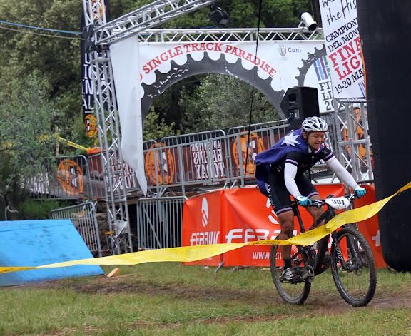 Jess Douglas (Australia) crosses the line to take the women's title