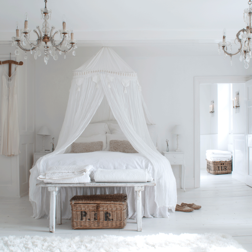 bedroom with white bedlinen cushion and white dress