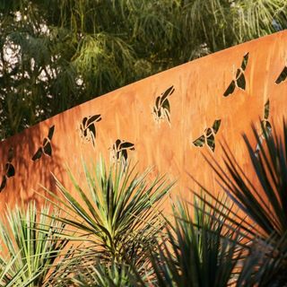 Corten steel planter with bee cutout design