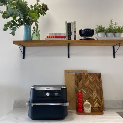 Ninja flexdrawer air fryer on white kitchen counter