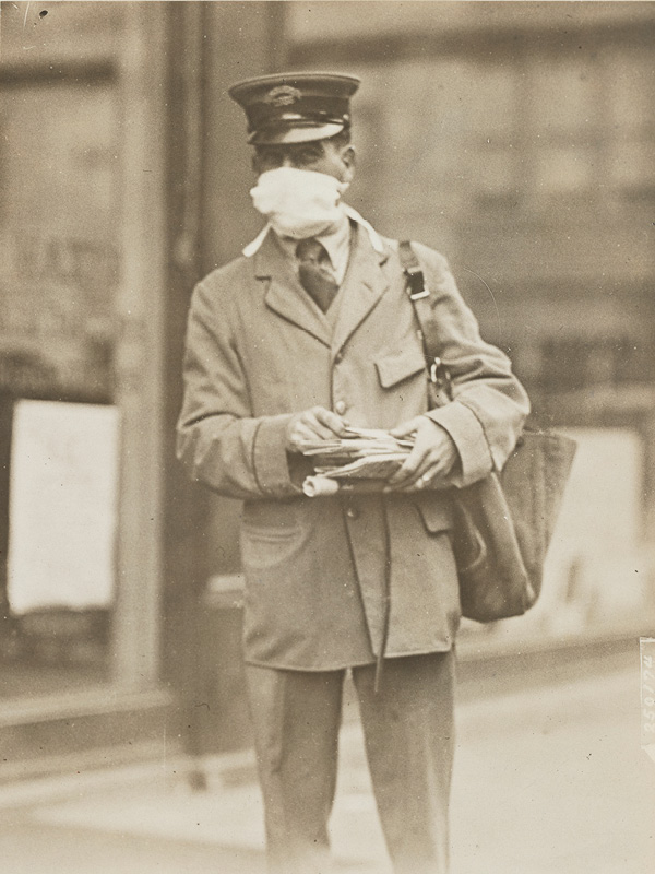 A postal worker wearing a gauze mask, New York, 1918