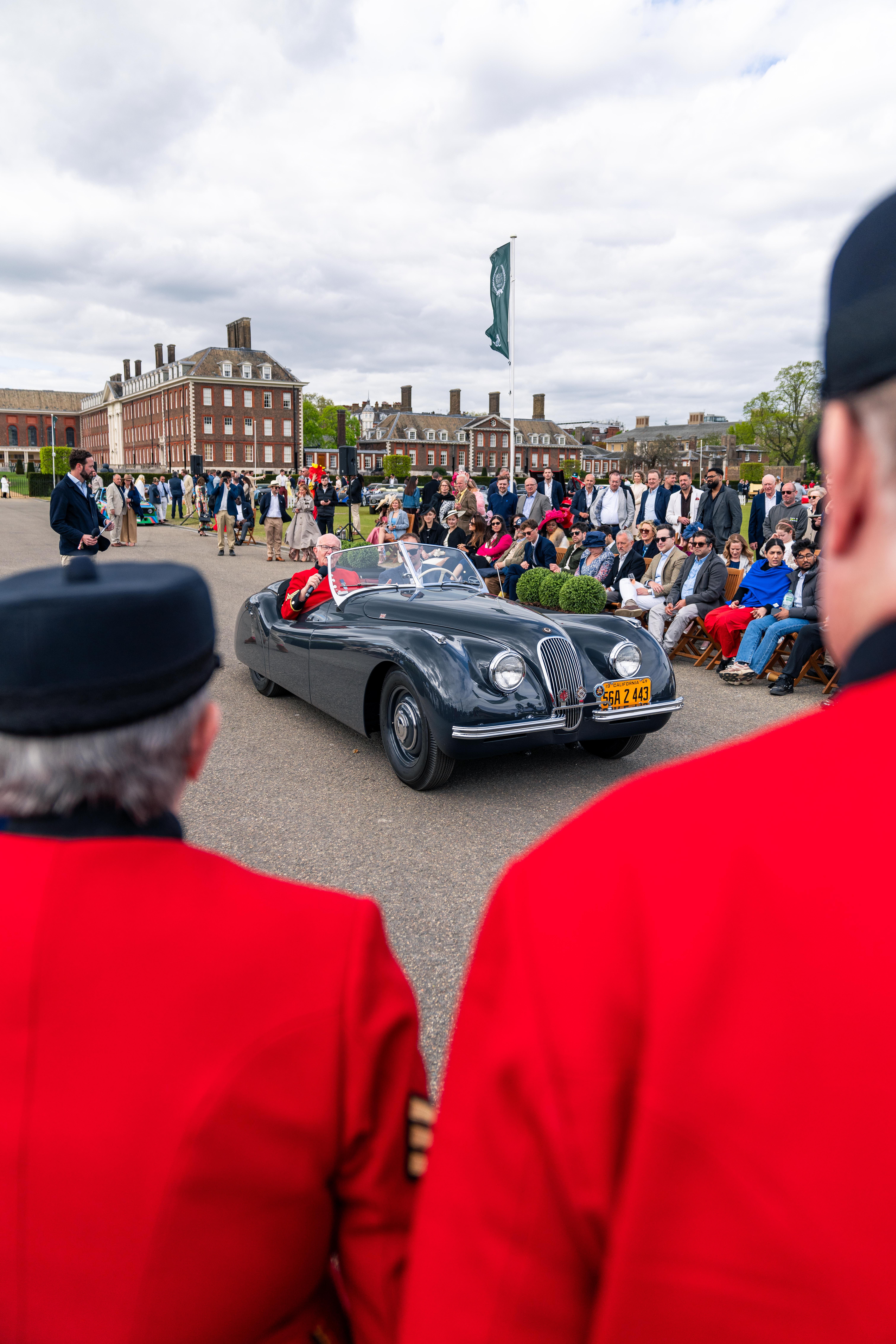 Two pensioners admire a jaguar