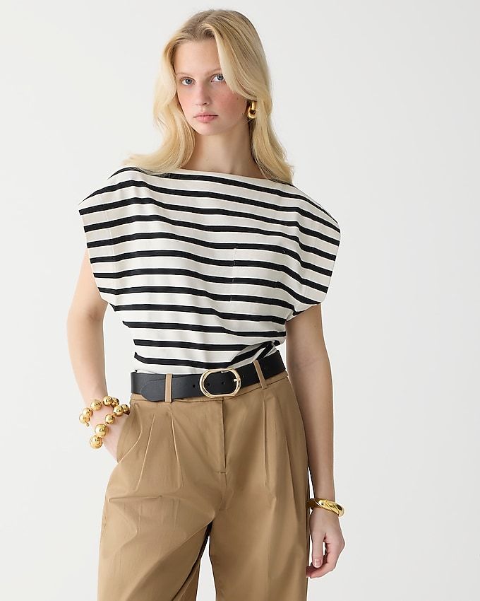 a model wears a boatneck muscle T-shirt