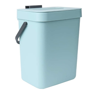 An aqua blue mini plastic trash can