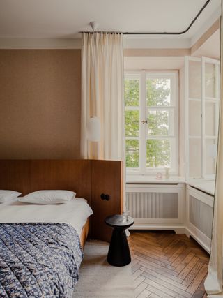 Minimalist bedroom with wooden headboard