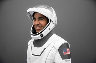 Crew-3 mission commander Raja Chari of NASA poses for a portrait in his SpaceX launch suit.