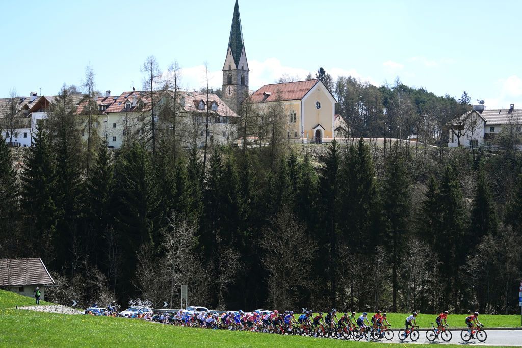 TOBLACH HOCHPUSTERTAL ITALY APRIL 20 A general view of the peloton passing through a landscape during the 45th Tour of the Alps 2022 Stage 3 a 1546km stage from Lana to Villabassa TouroftheAlps on April 20 2022 in Toblach Hochpustertal Italy Photo by Tim de WaeleGetty Images