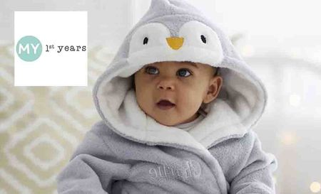 my 1st years logo placed over a toddler in a penguin onesie