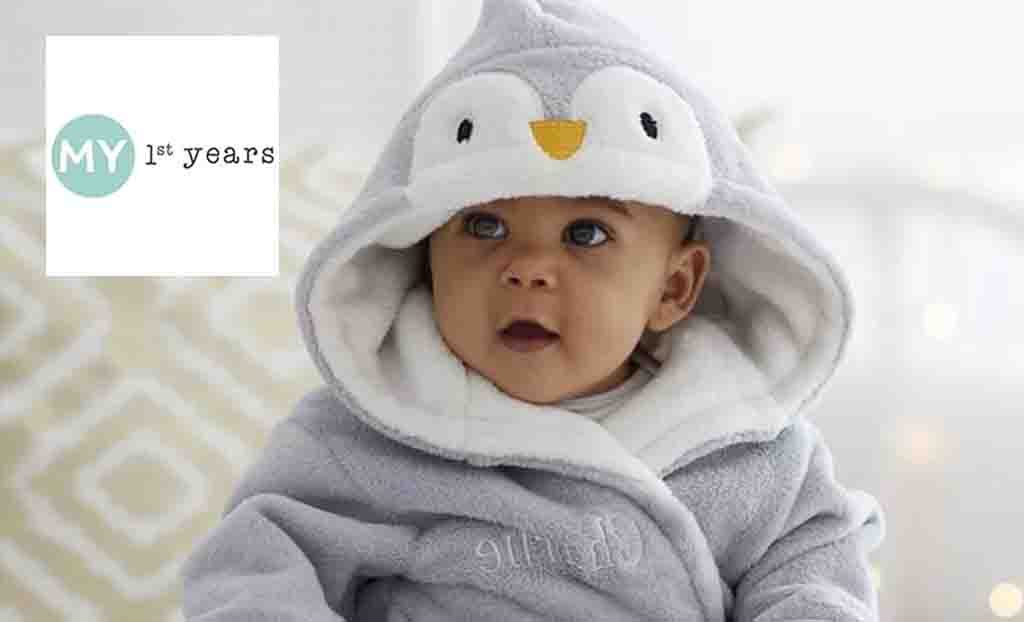 my 1st years logo placed over a toddler in a penguin onesie