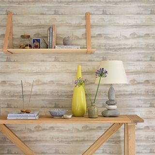 Wood panelled space with console table and wall shelf