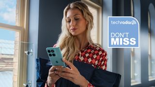 A woman holding the Motorola Edge 60 Fusion