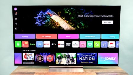 LG C6 OLED TV shown on a wood table