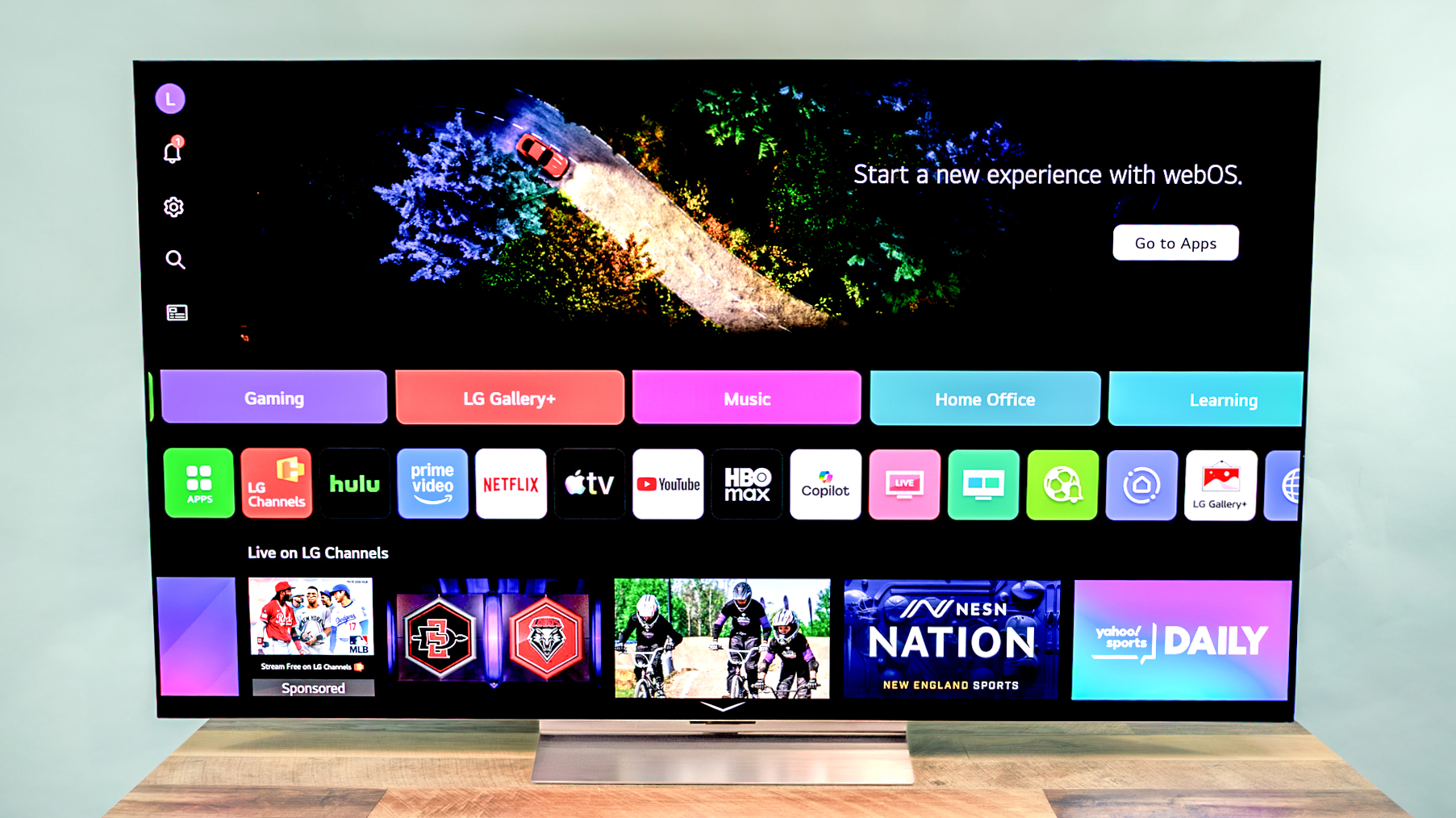 LG C6 OLED TV shown on a wood table