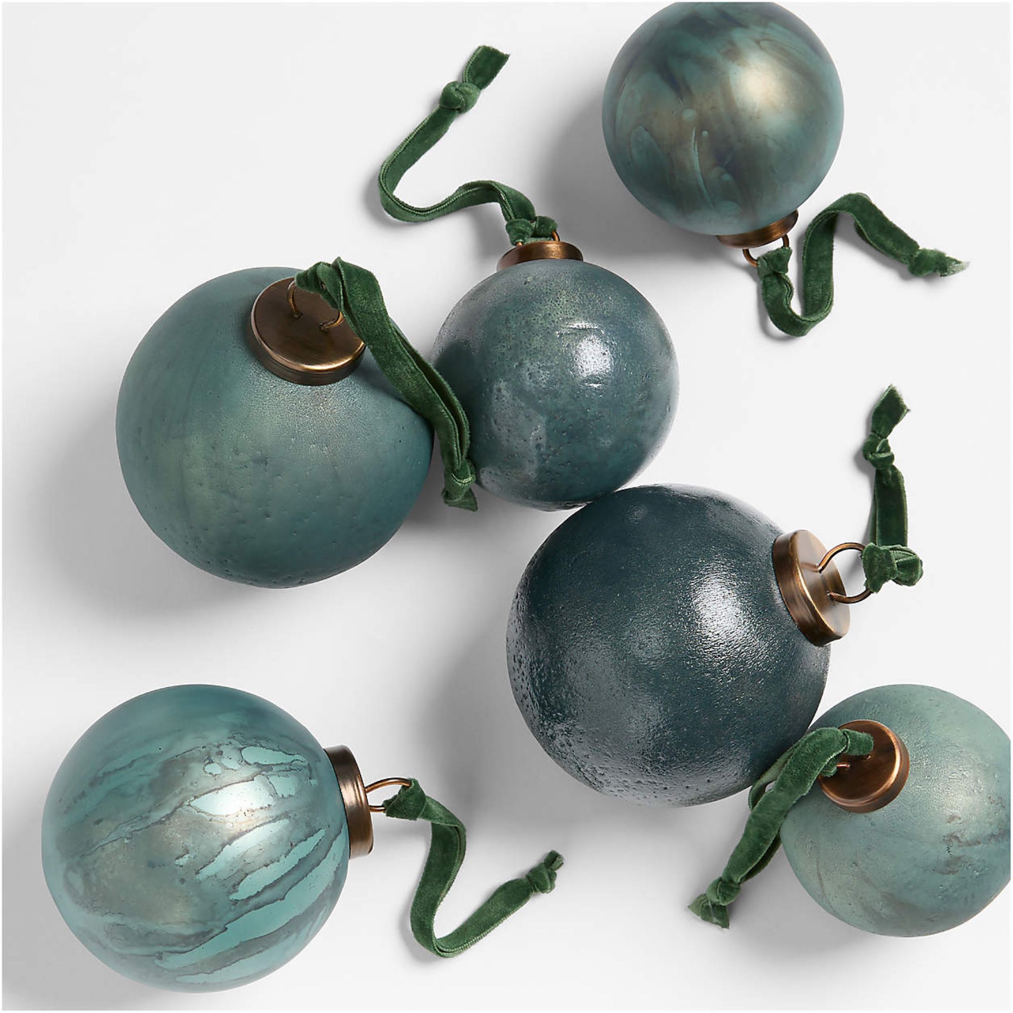 Blue glass ornaments with green velvet ribbons