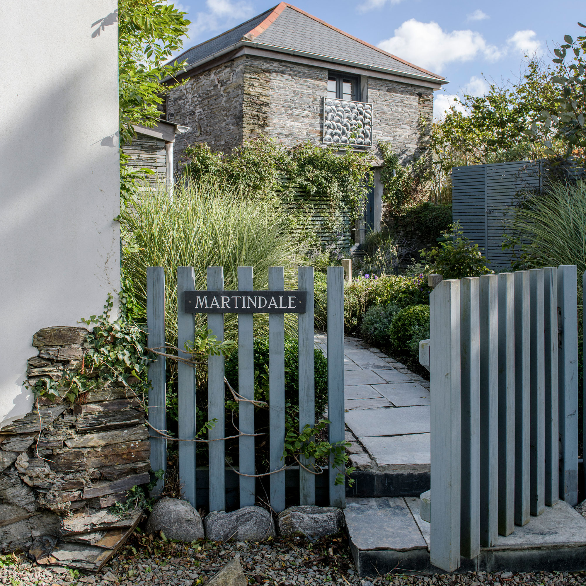 Blue gate with curved path