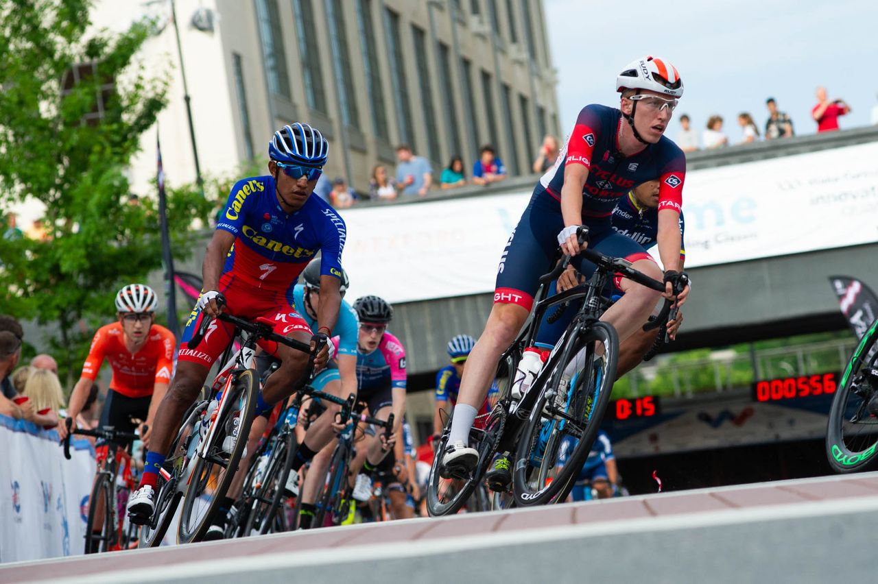 Riders crest the climb through turn one