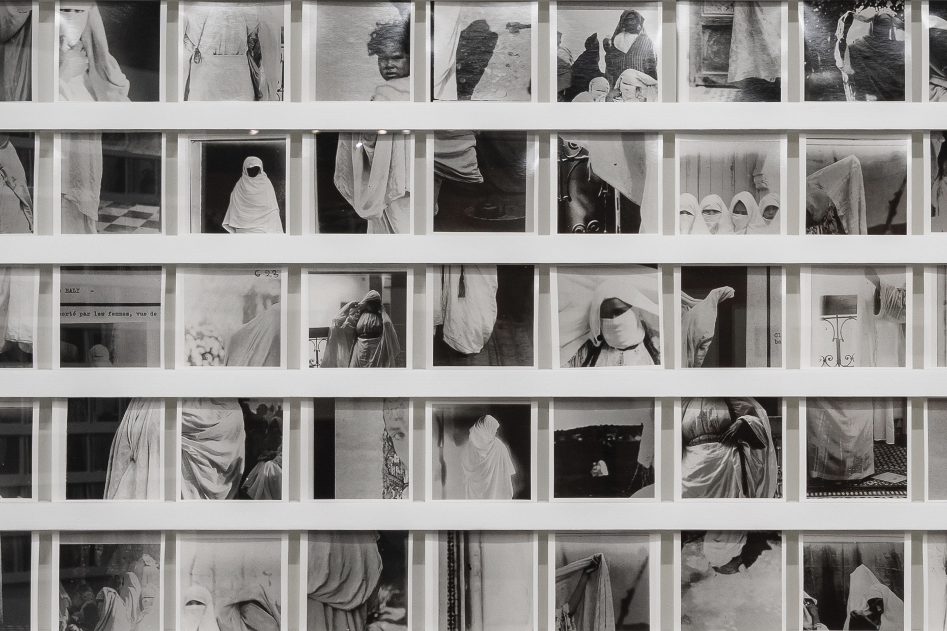 A grid of small archival photographs of veiled women in Morocco