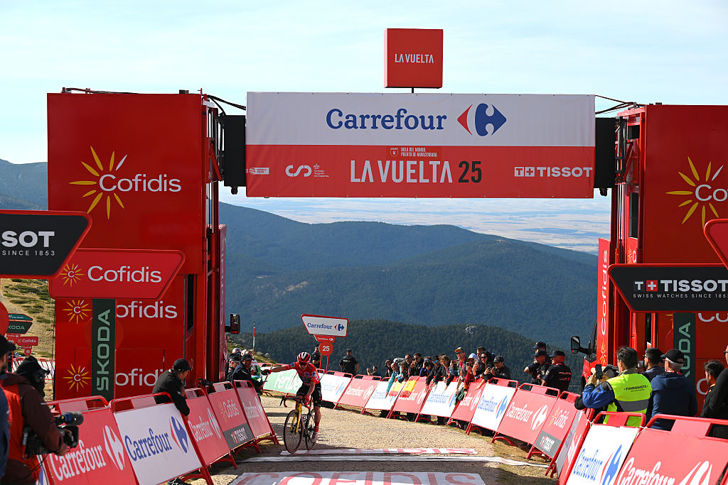 BOLA DEL MUNDO, SPAIN - SEPTEMBER 13: Jonas Vingegaard of Denmark and Team Visma | Lease a Bike - Red Leader Jersey celebrates at finish line as stage winner during the La Vuelta - 80th Tour of Spain 2025, Stage 20 a 164.8km stage from Robledo de Chavela to Bola del Mundo. Puerto de Navacerrada 2253m / #UCIWT / on September 13, 2025 in Bola del Mundo. Puerto de Navacerrada, Spain. (Photo by Tim de Waele/Getty Images)