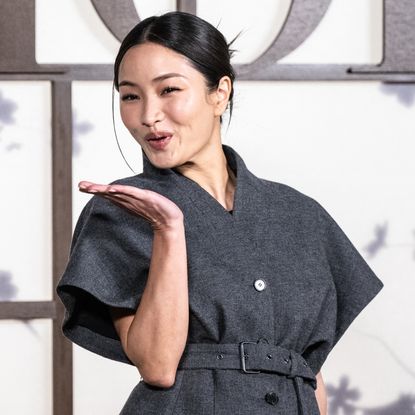 Anna Sawai wears a Dior skirt suit at the Dior pre-fall show