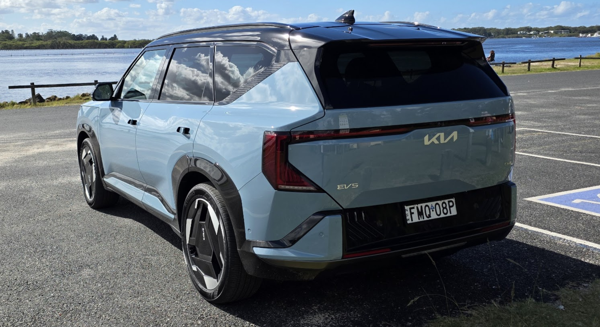 A Kia EV5 facing a lake