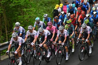 UAE Team Emirates protect their overall race leader Tadej Pogacar on the roads to Sappada on stage 19 at the Giro d'Italia