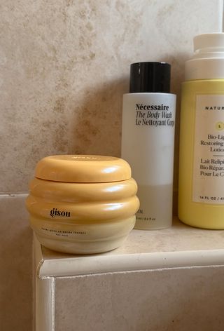 Gisou hair mask on bathroom shelf