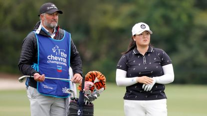 Angel Yin of the United States and her caddie wait on the fifth hole during the final round of The 2023 Chevron Championship