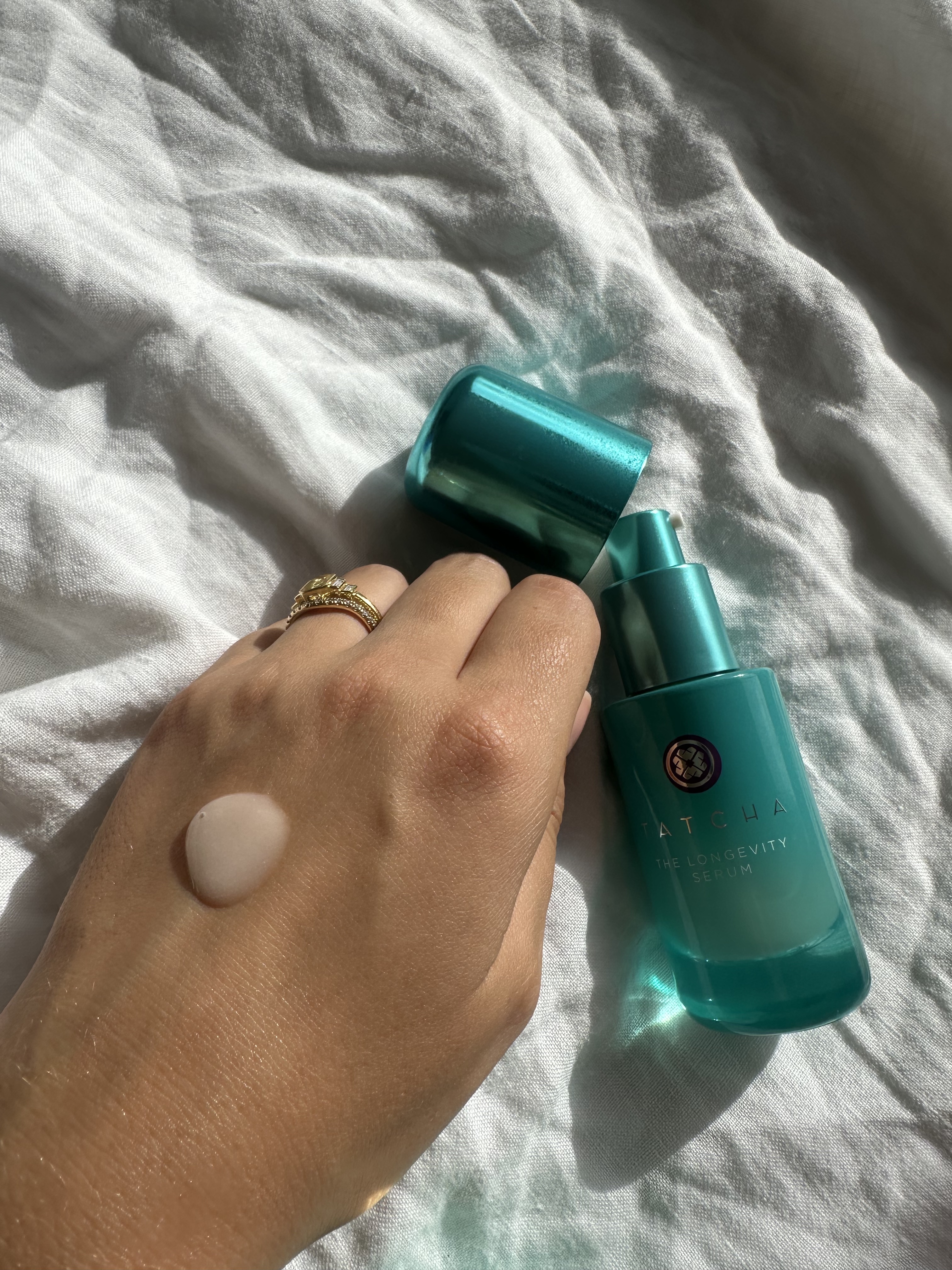 Shannon Lawlor with a swatch of Tatcha Longevity Serum on her ahnd