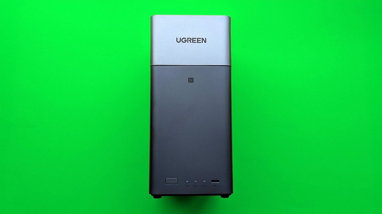 UGREEN NASync DH2300 on a green card paper background