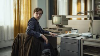 Martin Rauch (Jonas Nay) sits at a 1980s-style computer in Deutschland 89