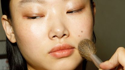 Yoon Young Bae is seen during the make up in backstage at the Ermanno Scervino Fashion Show during the Milan Fashion Week Womenswear Spring/Summer 2023 on September 24, 2022 in Milan, Italy.