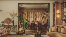 lush living space inside Rome residence by Prime Design, golden colour tones and rich materials