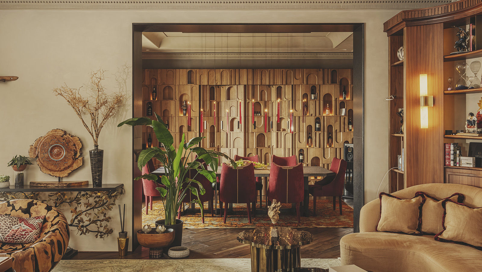 lush living space inside Rome residence by Prime Design, golden colour tones and rich materials