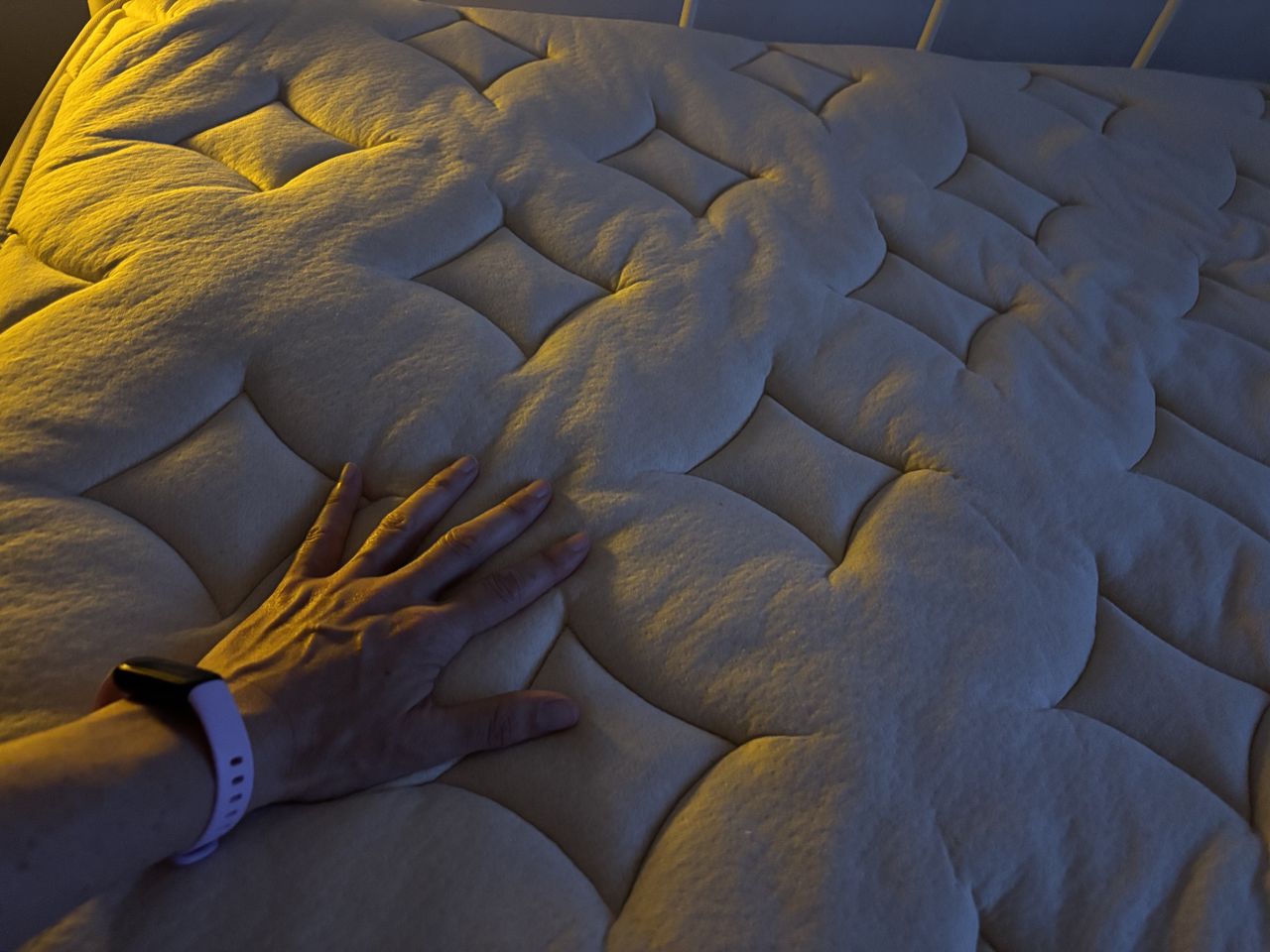 The image shows the beige Birch Elite Mattress in our mattress reviewer's home during the testing process