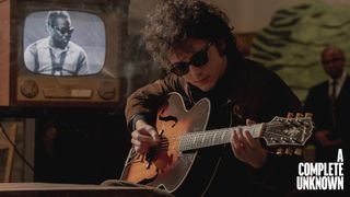 Timothée Chalamet as Bob Dylan with Gibson acoustics in a still from A Complete Unknown, the James Mangold biopic about the iconic singer-songwriter