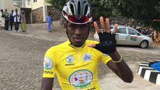 Race leader Valens Ndayisenga gives the Qhubeka high five