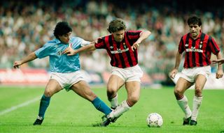 AC Milan's Carlo Ancelotti holds off Napoli's Diego Maradona in a Serie A match in Otober 1990.
