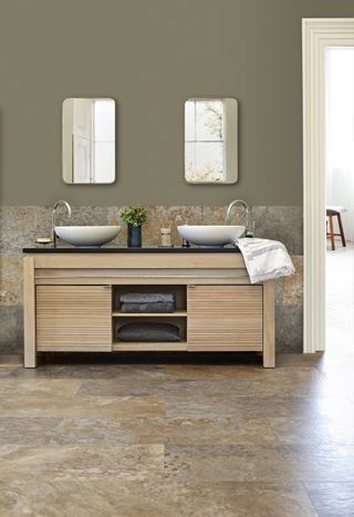 bathroom with non-slip tiled flooring, double basin vanity with storage, two mirrors