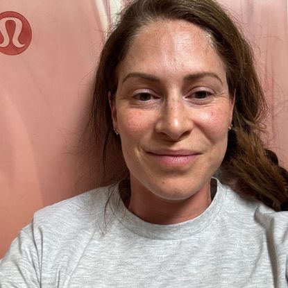 Health writer Anna Bartter trying the Pilates roll like a ball move every day, lying on her yoga mat post workout