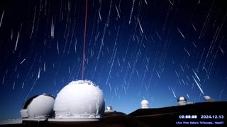 Geminid meteor streaks light up amid star trails over the Subaru Telescope in Hawaii.