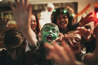 Kids dressed up as zombies for Halloween.