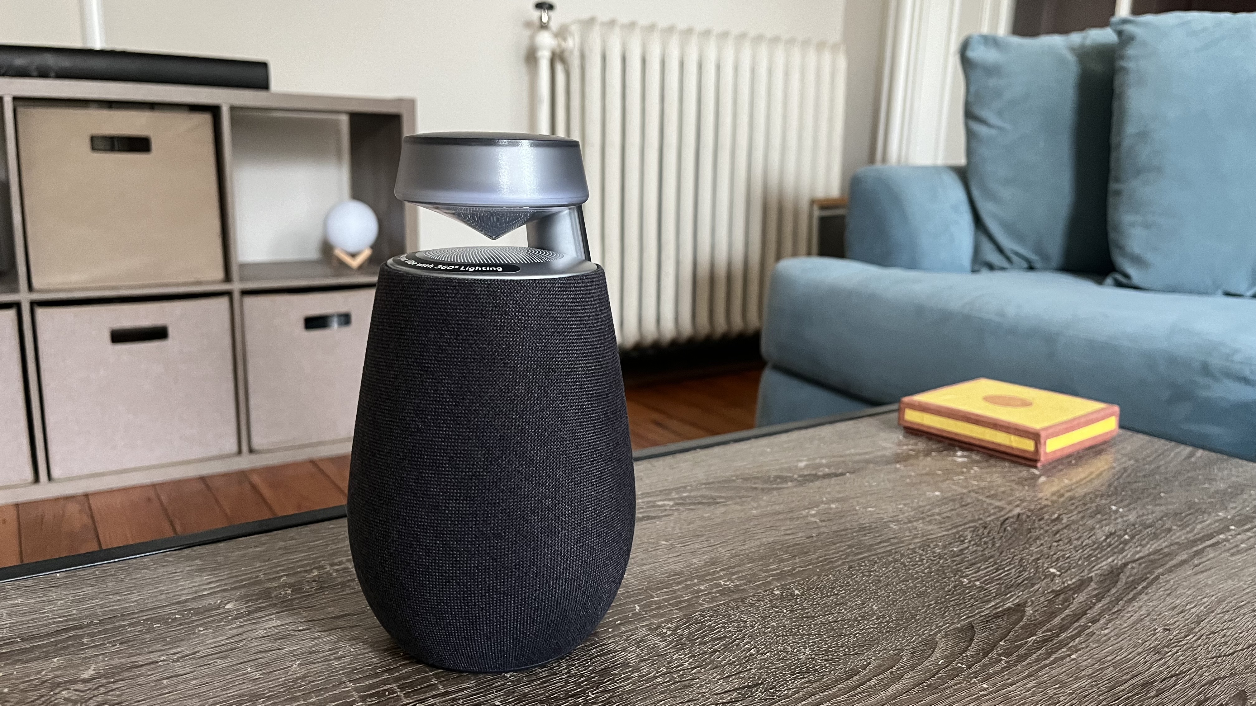 LG XBoom XO2T speaker, illuminated, in a listening room