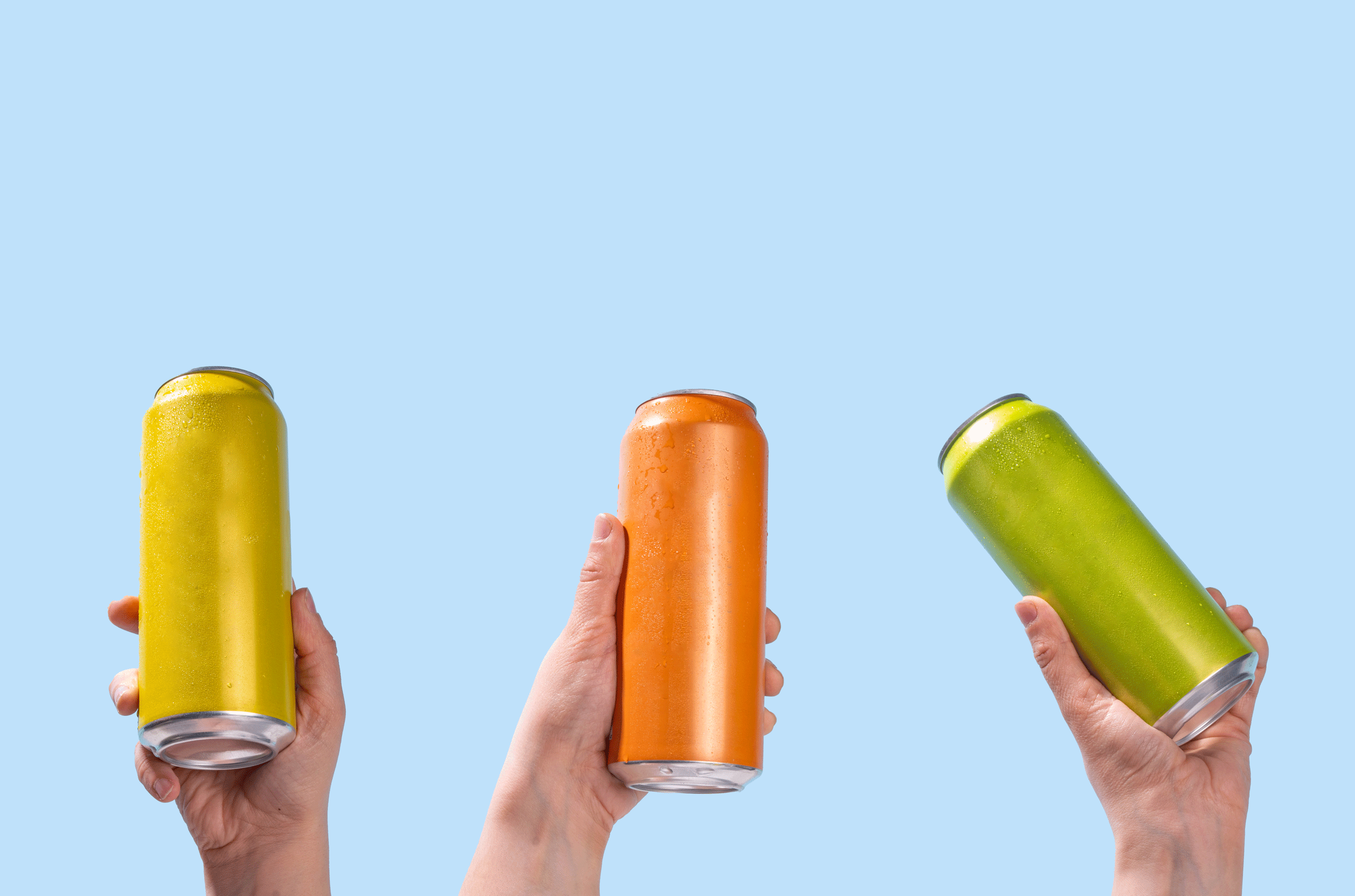 Hands holding canned drinks