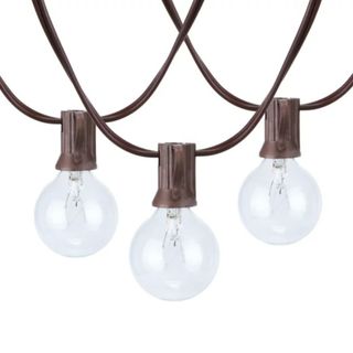 Three dark brown strings of string lights with circular glass globes