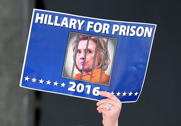 A Trump supporter hoists a sign at a Nevada rally.