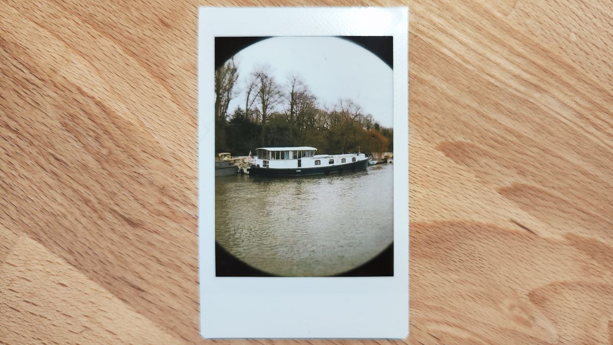 Instant photos on a wooden table
